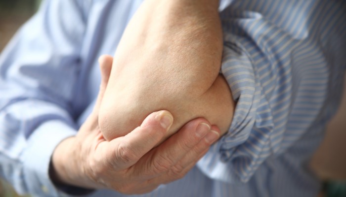 businessman with sore elbow