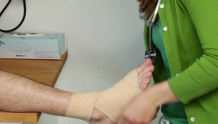 Fixing-bandages-on-ankle