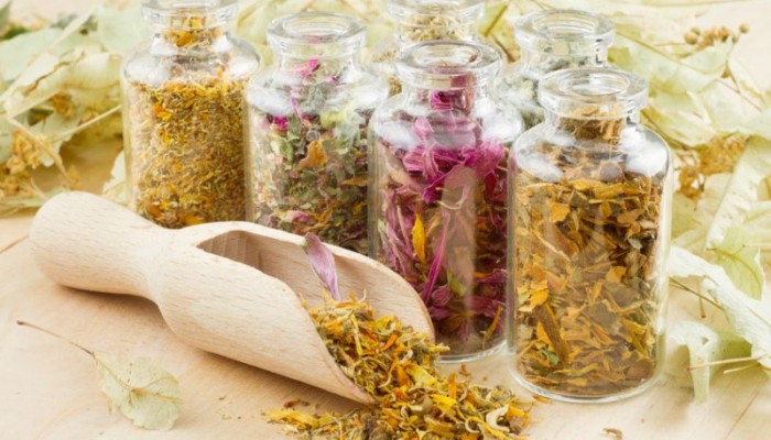 healing herbs in glass bottles, herbal medicine