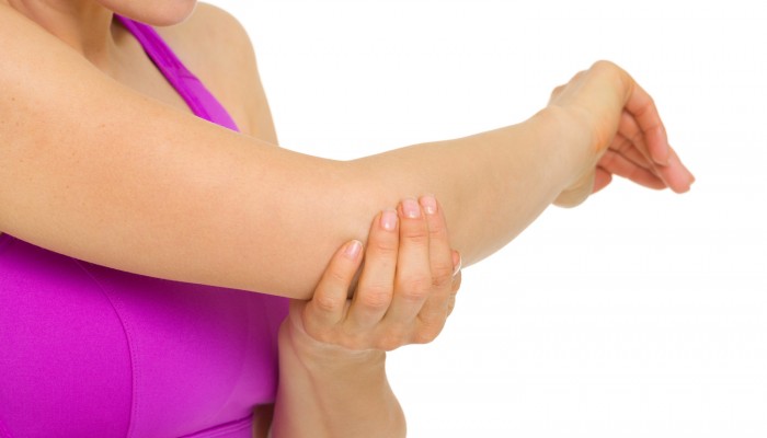 Closeup on woman with elbow pain
