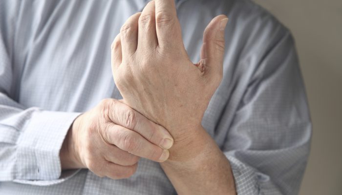 man has pain in wrist