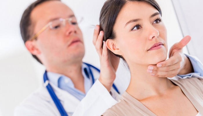 Injured woman at the doctor for a back problem